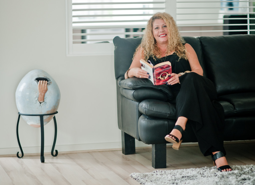 Dr Lynette sitting and reading a book 