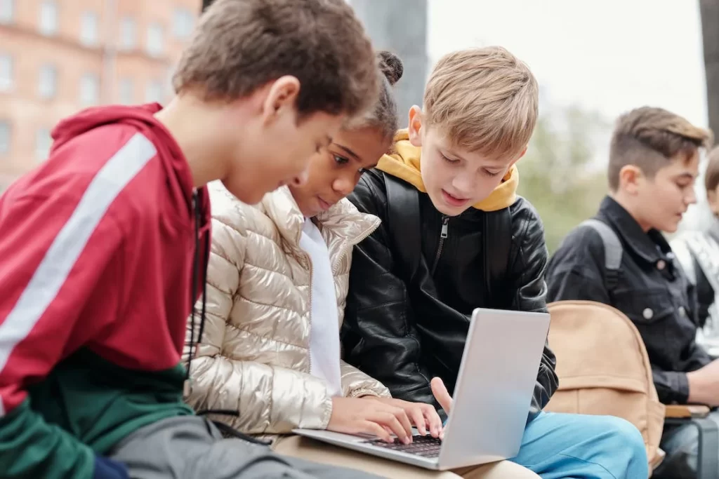 Children crowded round a laptop